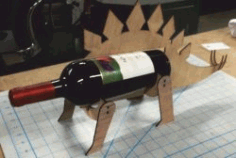 Cnc Laser Cut Stegosaurus Shaped Wine Bottle Holder Free Vector File